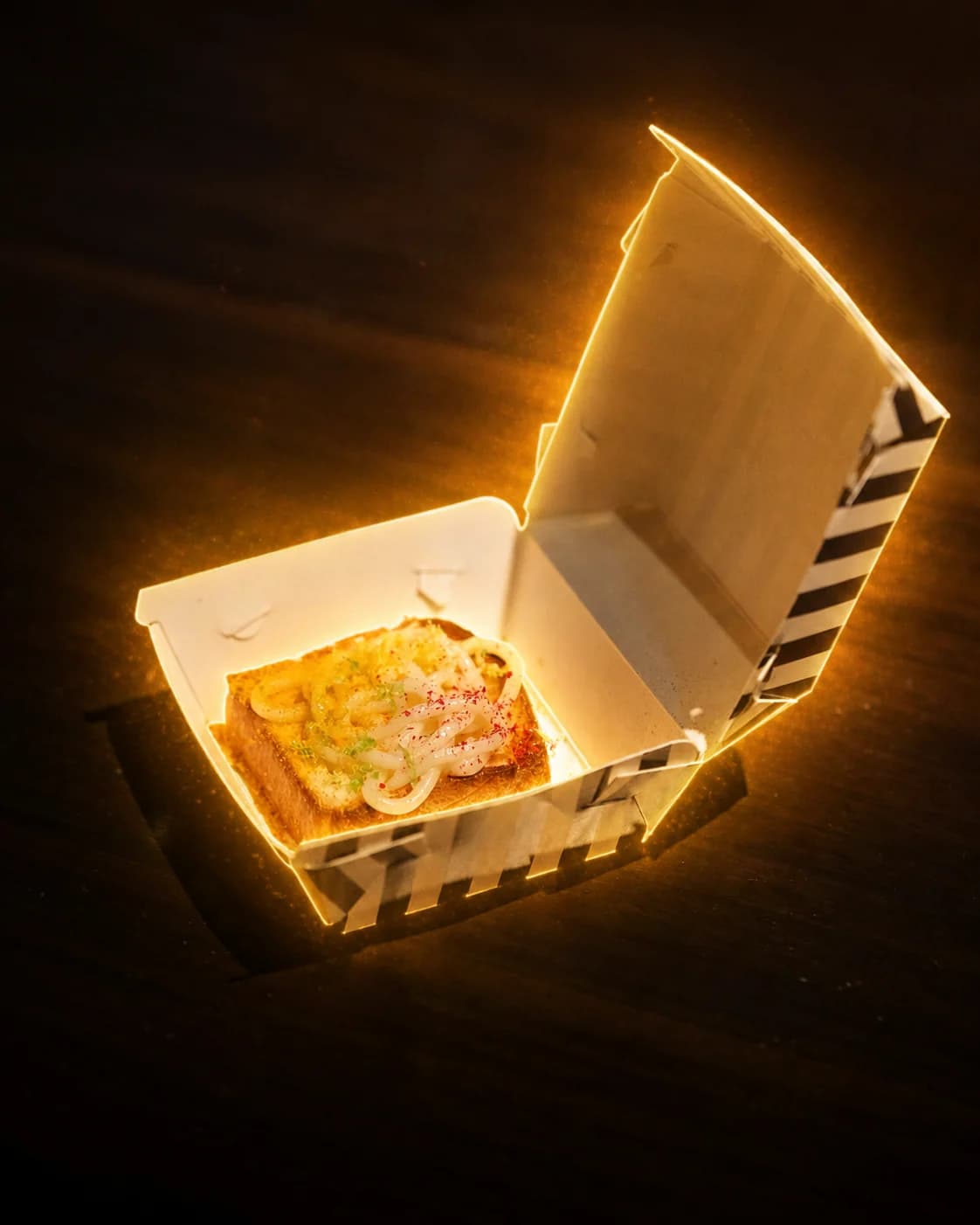 Takeout surrounded by the GLOWIFY golden aura